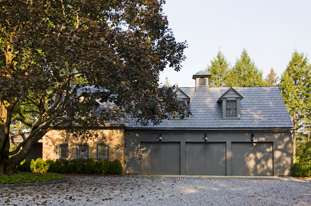 Inspiration for an expansive rural detached garage in Philadelphia with three or more cars.