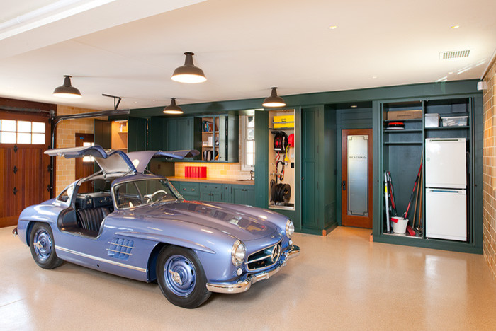 This is an example of a large traditional attached garage in Other with three or more cars.