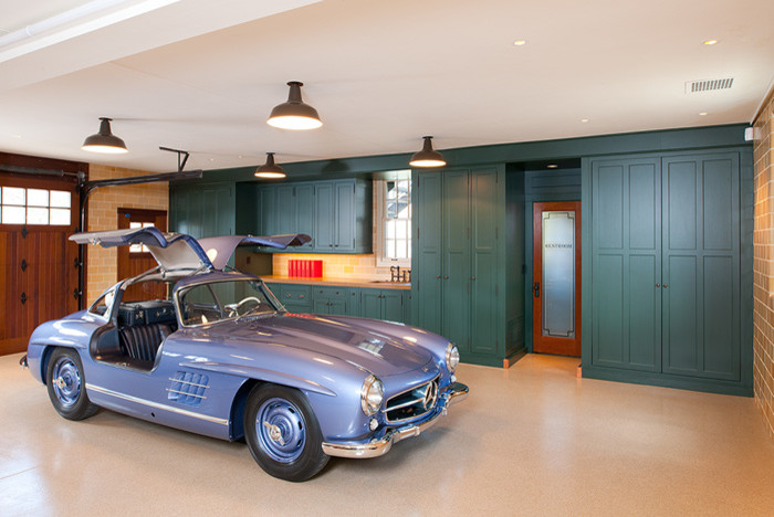 Inspiration for a large traditional attached garage in Other with three or more cars.