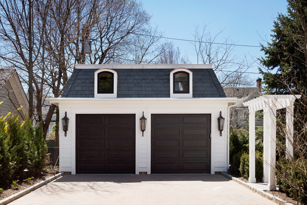 This is an example of a medium sized victorian detached double garage in New York.