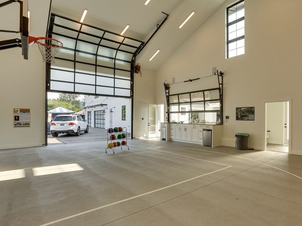 Example of a large farmhouse detached garage design in Portland