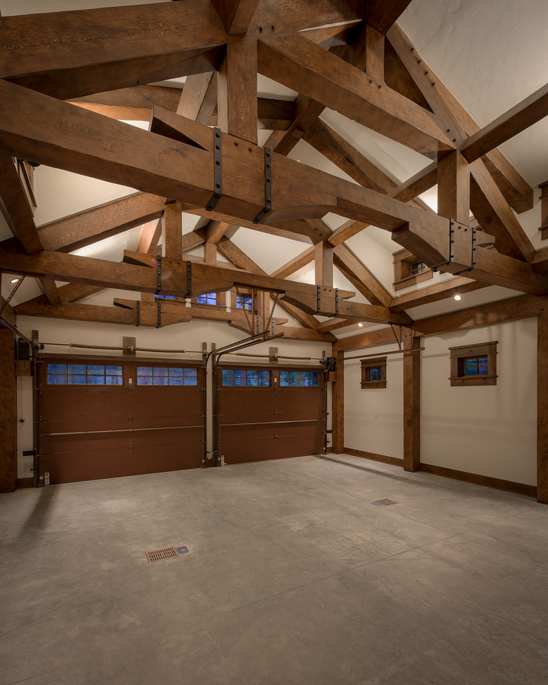 Inspiration for a medium sized rustic attached double garage in Denver.