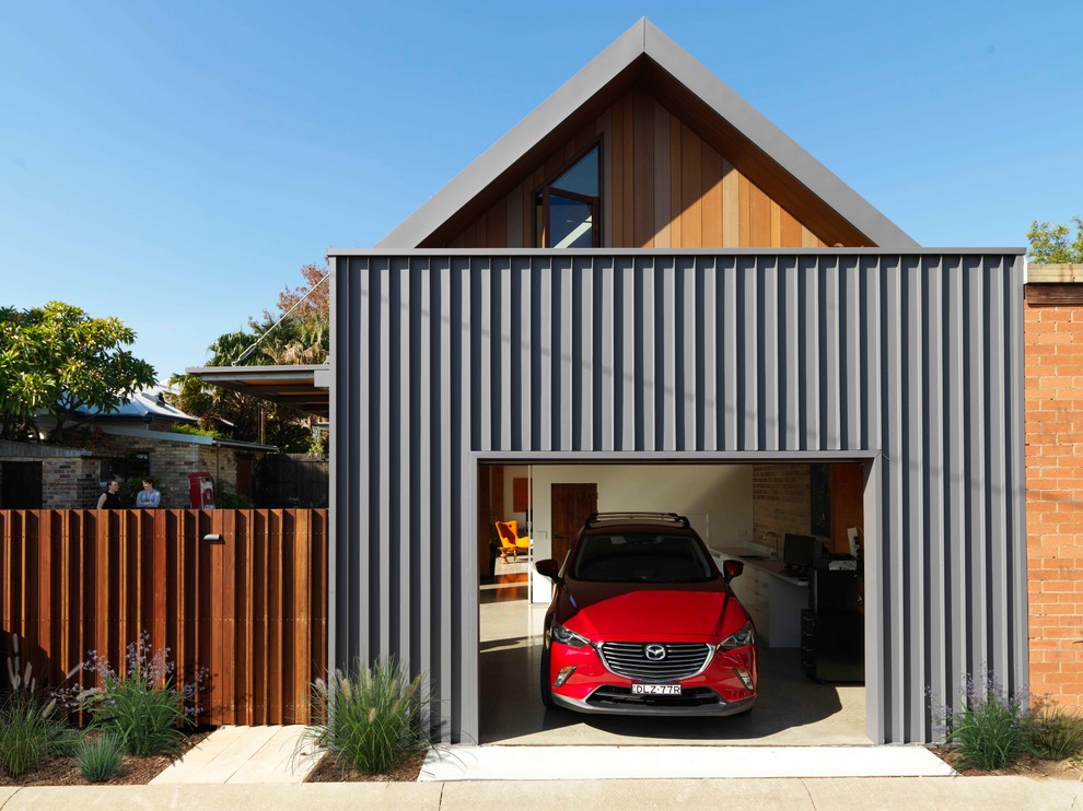 Свежая идея для дизайна: пристроенный гараж в современном стиле для одной машины - отличное фото интерьера