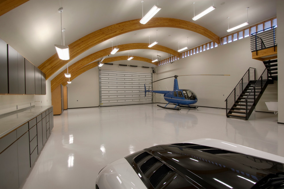 Garage - contemporary three-car garage idea in Seattle