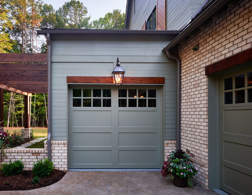 Example of a mid-sized classic attached garage design in Charlotte
