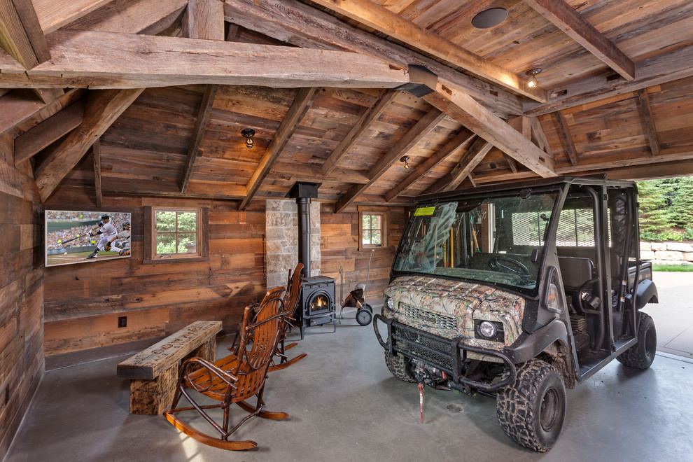 Photo of a large rustic single garage workshop in Minneapolis.