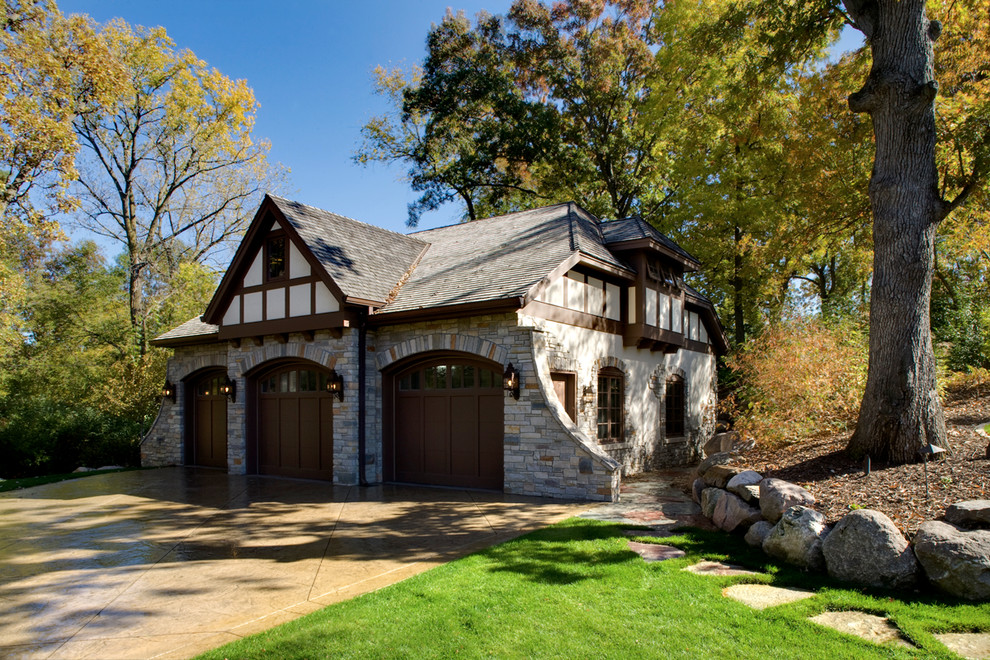 Inspiration for a timeless three-car garage remodel in Minneapolis