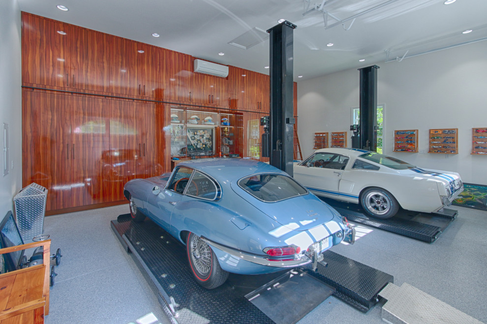 Medium sized classic attached garage in Other with four or more cars.