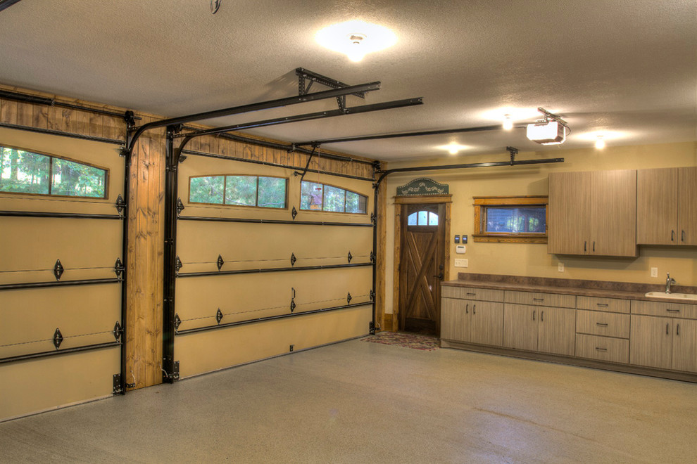 Photo of a small rustic double garage in Minneapolis.