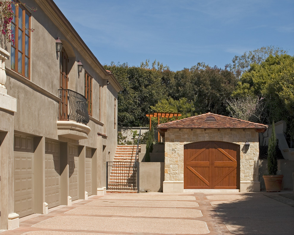 Tuscan attached four-car carport photo in San Diego