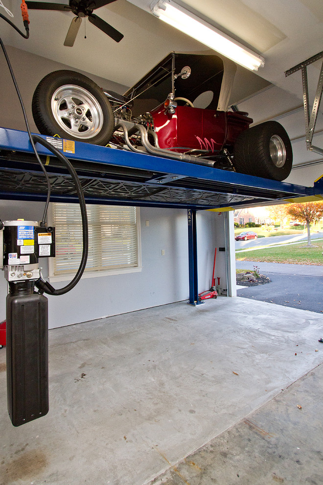 Inspiration for a timeless attached three-car garage remodel in Other