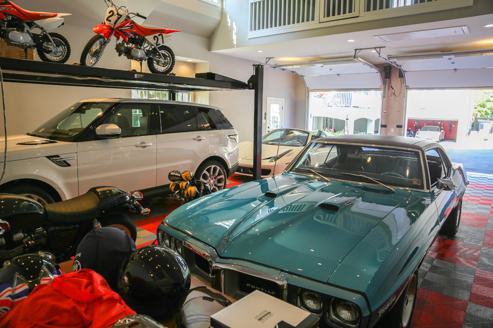 This is an example of a large classic detached garage workshop in Richmond with three or more cars.