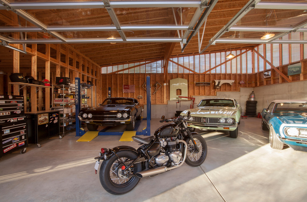 Inspiration for a large retro detached garage workshop in Indianapolis with four or more cars.