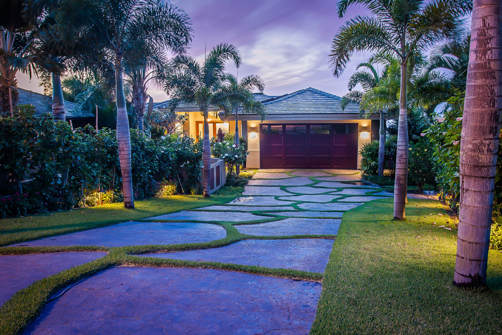 Inspiration for a medium sized world-inspired attached double garage in Hawaii.