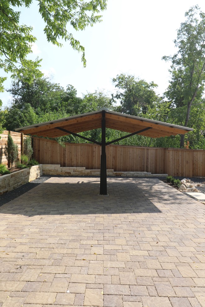 Inspiration for a medium sized traditional detached carport in Austin with four or more cars.