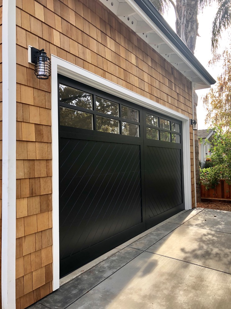 Example of a large cottage attached two-car garage design in San Francisco