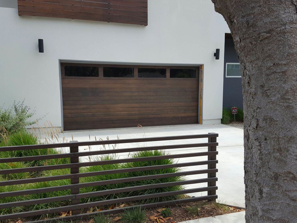 Inspiration for a medium sized modern attached double garage in Los Angeles.