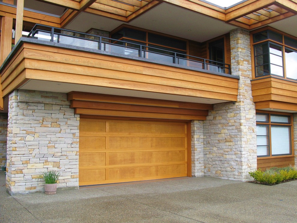 Inspiration for a mid-sized timeless attached two-car carport remodel in Vancouver