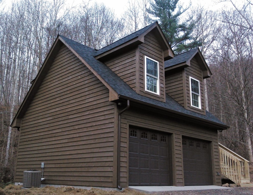 Example of a mid-sized classic detached two-car garage design in Other