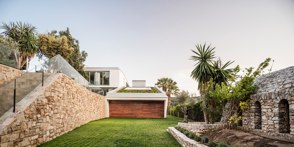 This is an example of a modern attached double garage in Other.