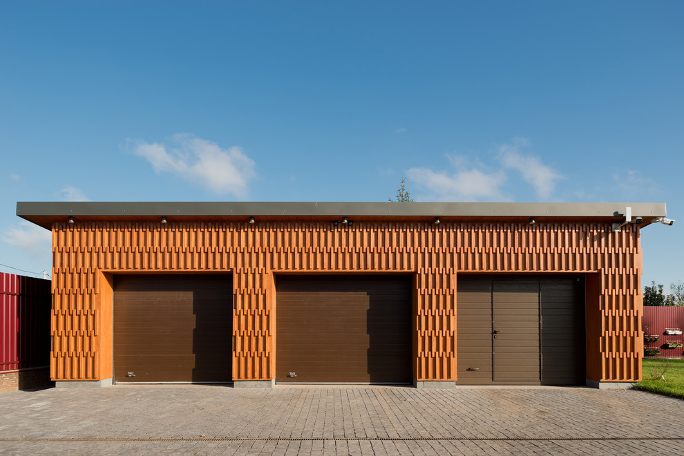 Medium sized contemporary detached garage in Moscow with three or more cars.