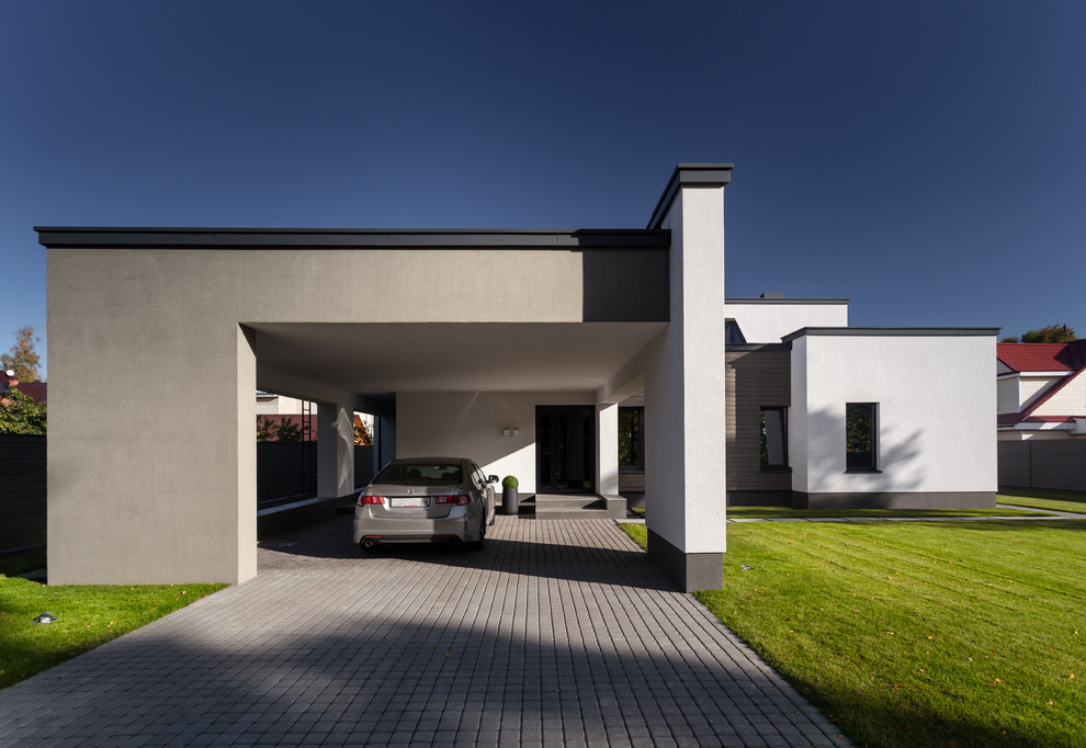 Источник вдохновения для домашнего уюта: пристроенный гараж в современном стиле с навесом над входом