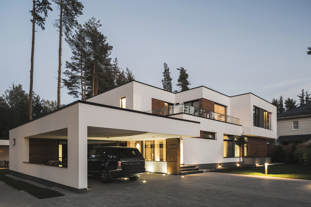 Inspiration for a large contemporary attached double carport in Saint Petersburg.