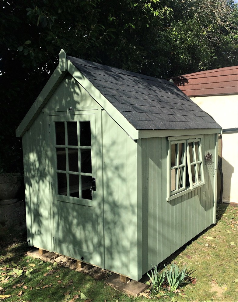 Photo of a medium sized modern detached garden shed in Other.