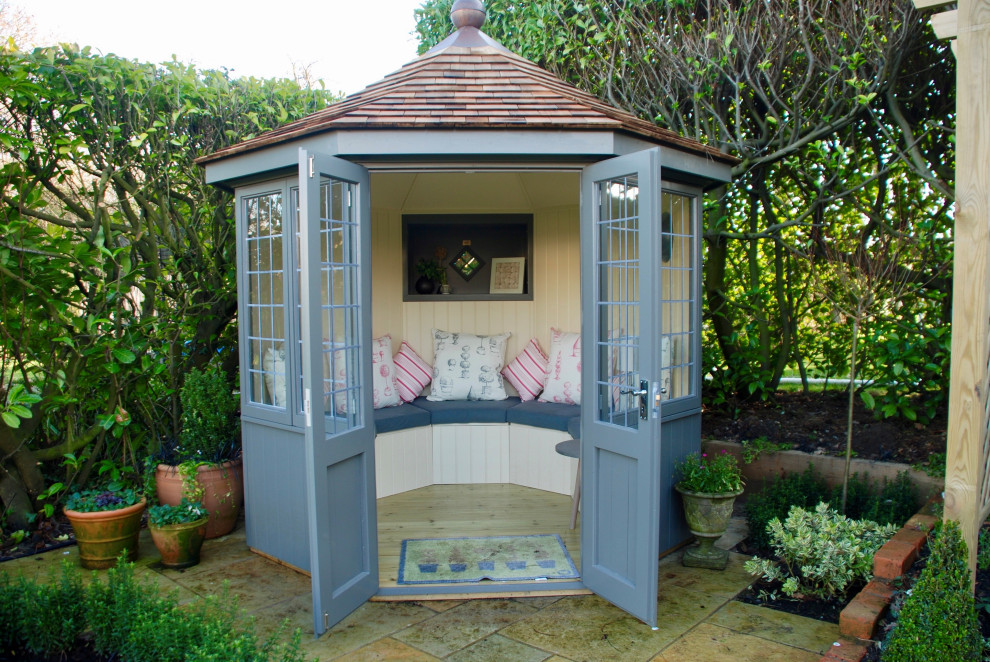 Photo of a medium sized classic detached garden shed and building in Other.