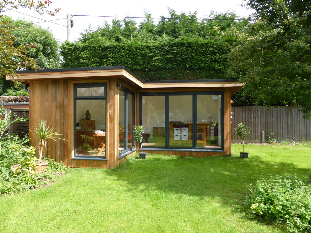 This is an example of a contemporary garden shed and building in West Midlands.