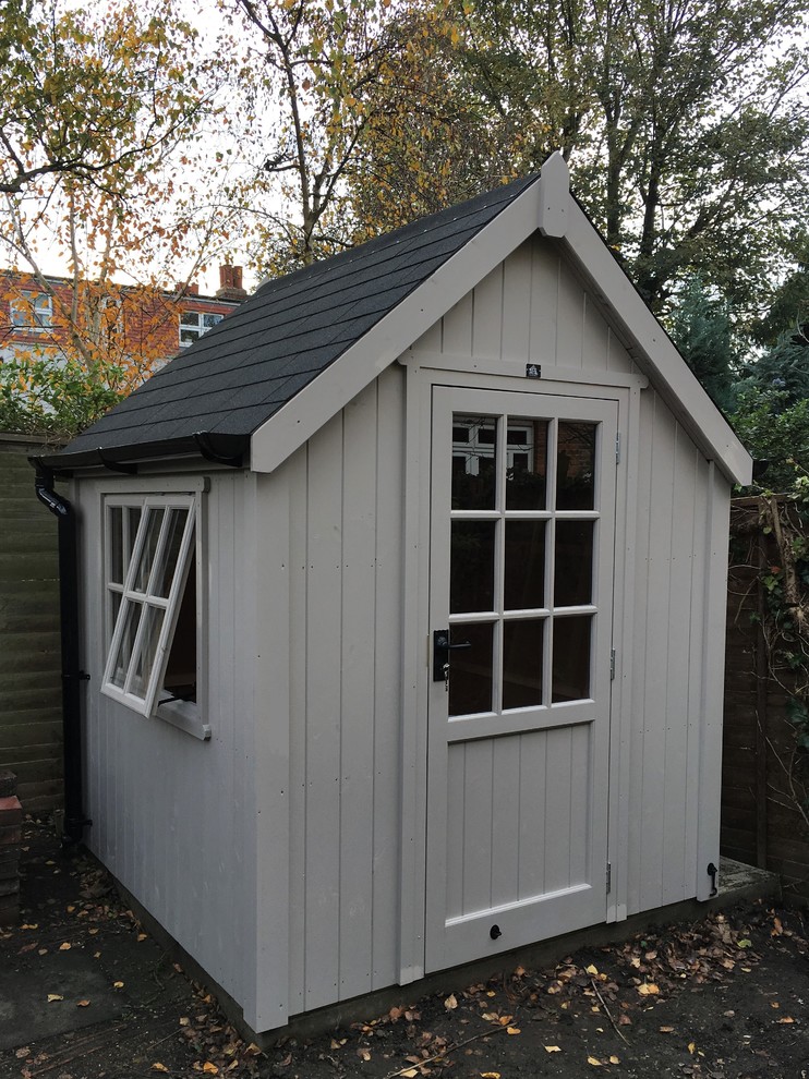 Photo of a medium sized modern detached garden shed in London.