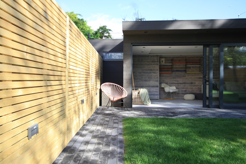 Studio / workshop shed - mid-sized contemporary detached studio / workshop shed idea in Surrey
