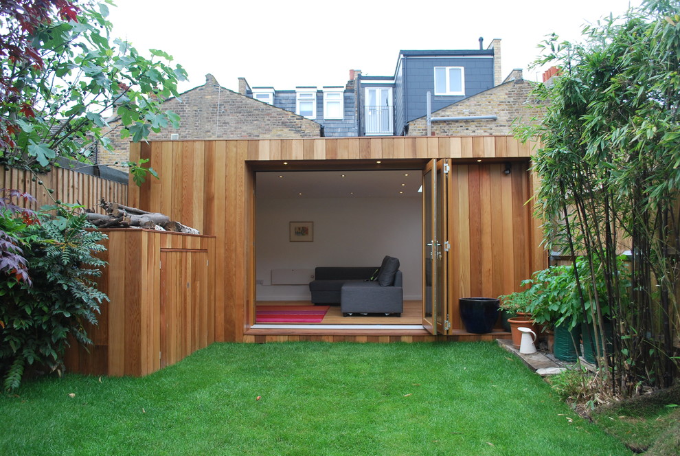 Mid-sized trendy detached studio / workshop shed photo in London