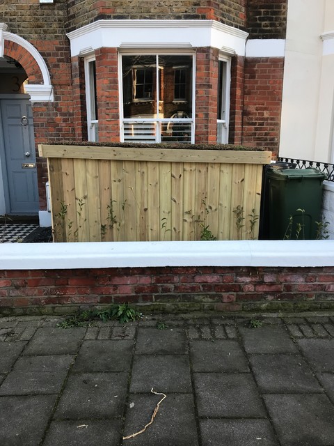 Low roof Slot in bike shed Contemporary Shed Sussex by