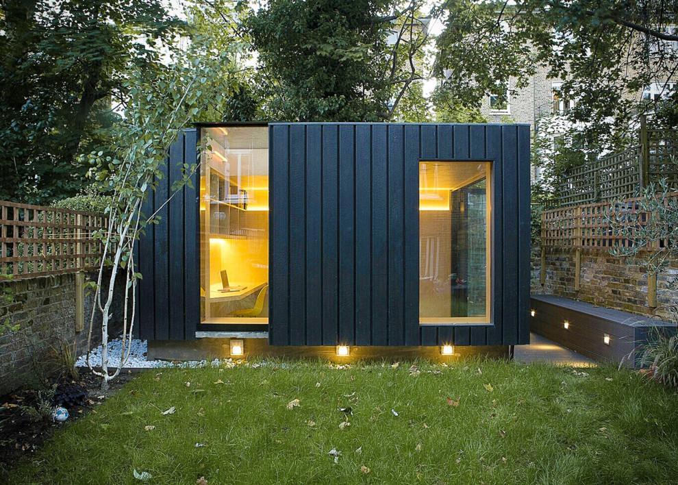 Idées déco pour un abri de jardin contemporain avec un bureau, studio ou atelier.