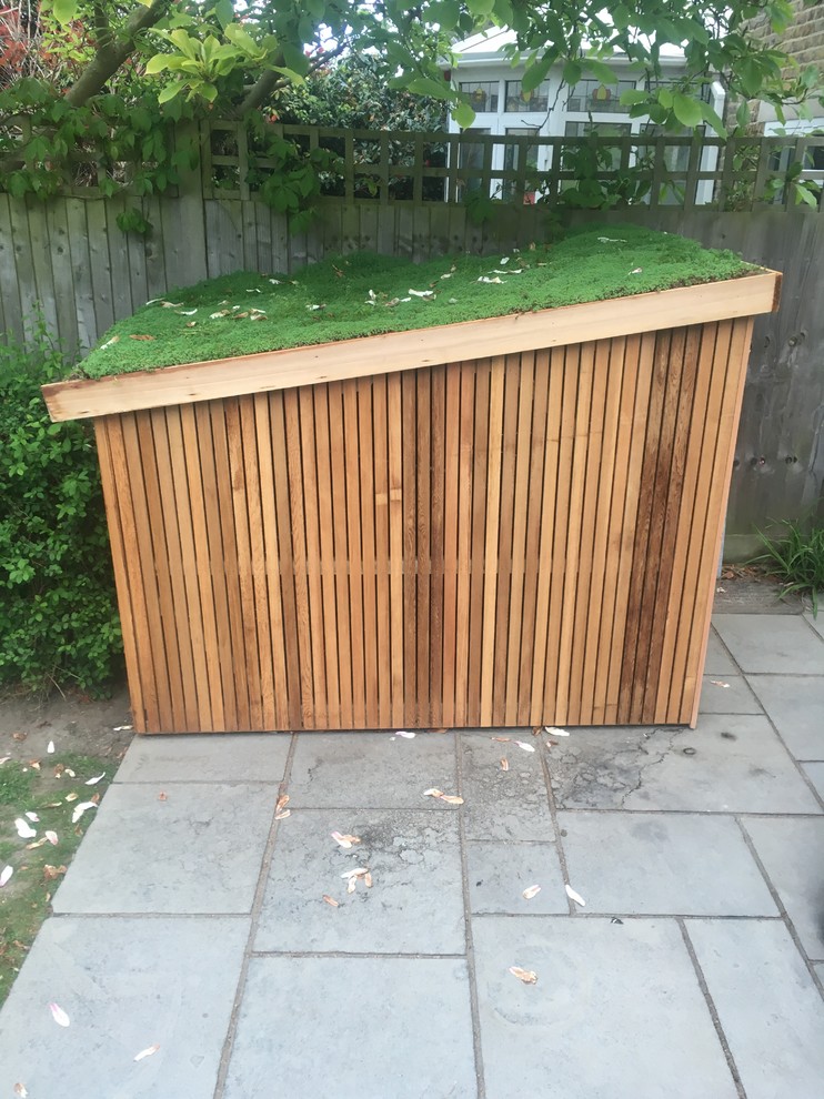 This is an example of a small contemporary detached garden shed in London.