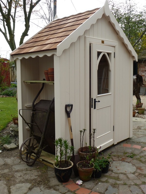 Photo of a small classic garden shed and building.