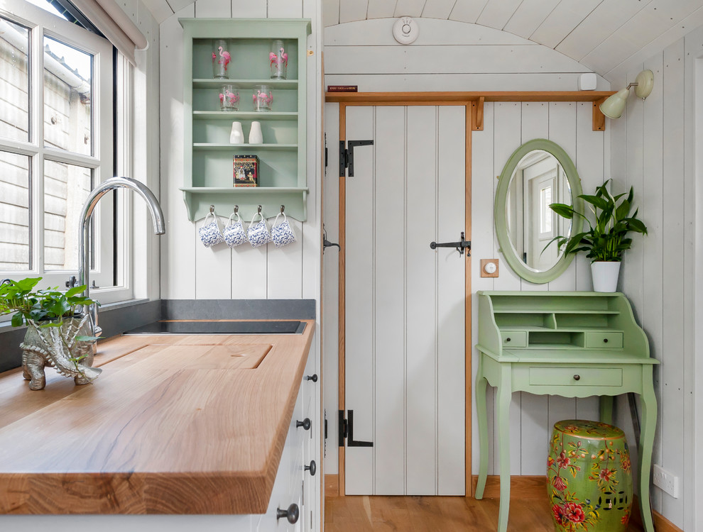 Design ideas for a shabby-chic style garden shed and building in Other.