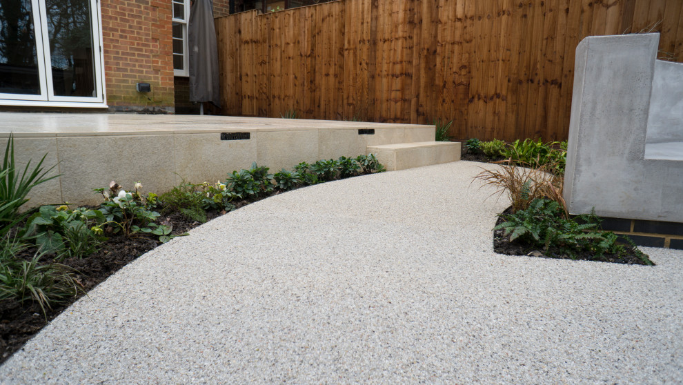 Design ideas for a medium sized contemporary back partial sun garden for summer in London with a pathway and decking.