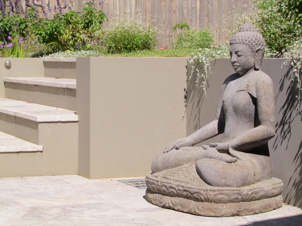 Photo of a large contemporary full sun backyard stone landscaping in Sydney for summer.