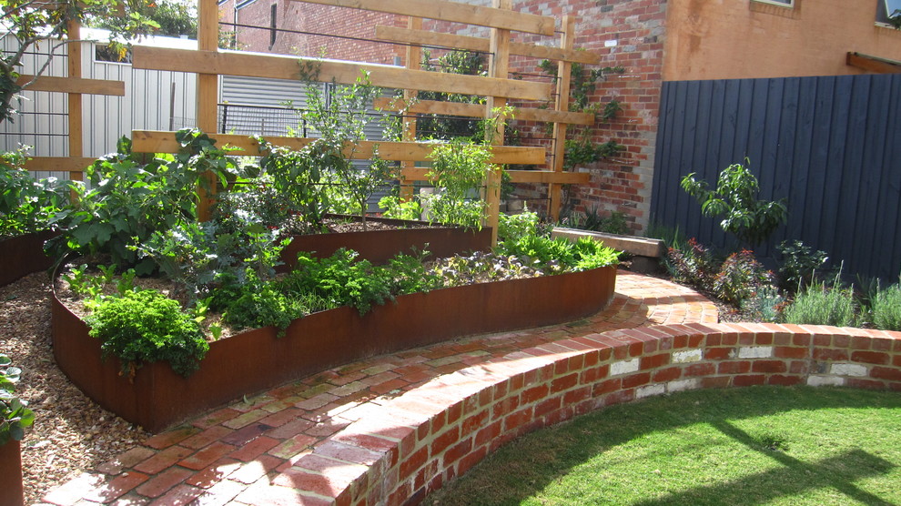 Inspiration for an eclectic fully shaded garden in Melbourne with a garden path and brick paving.