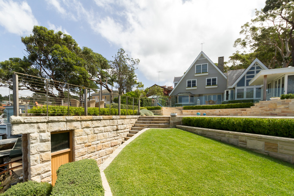 This is an example of a mid-sized coastal backyard landscaping in Sydney.