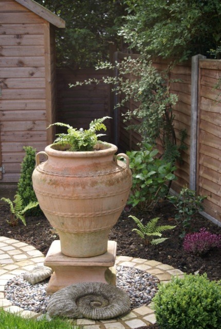 Medium sized contemporary back partial sun garden in Cheshire.