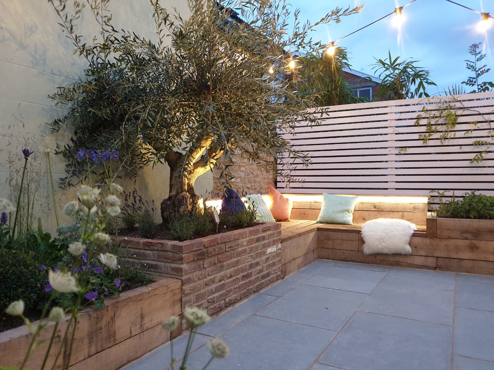 Small rustic courtyard partial sun garden for autumn in Other with natural stone paving.
