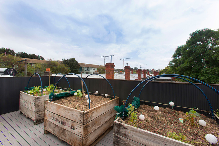 Inspiration for a small contemporary full sun rooftop vegetable garden landscape in Melbourne with decking.