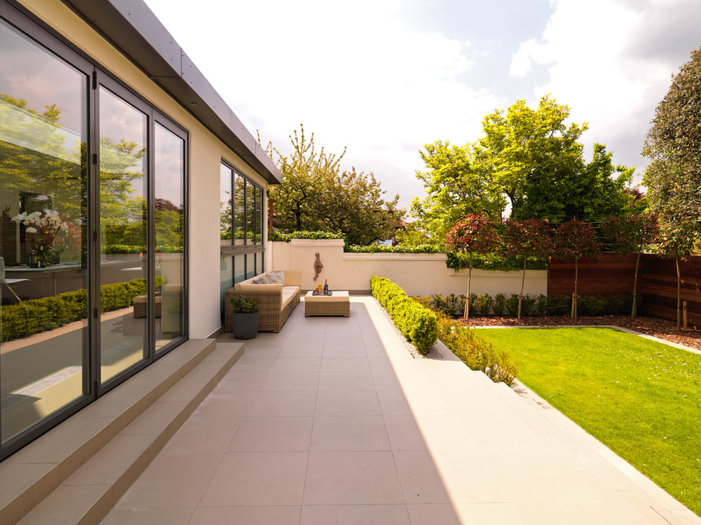 Photo of a contemporary back full sun garden for summer in London with decking.