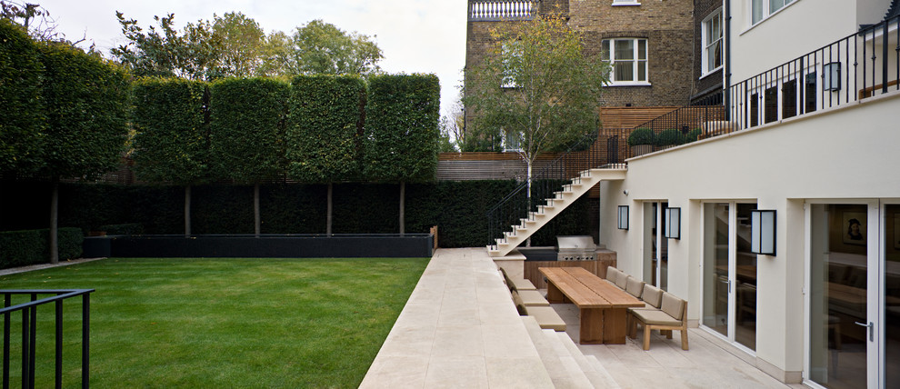 Photo of a large contemporary back formal garden in London.