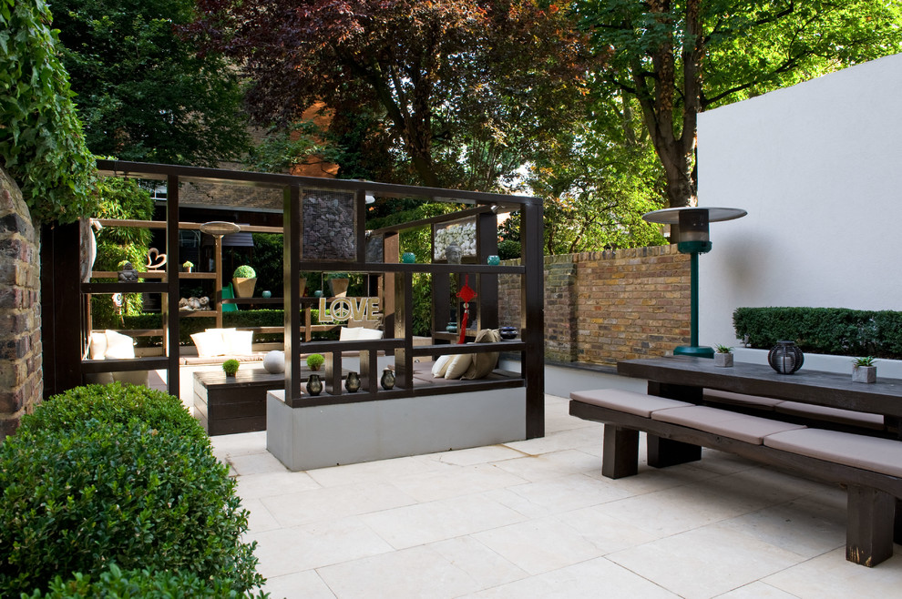 Inspiration for a medium sized world-inspired back formal fully shaded garden in London.
