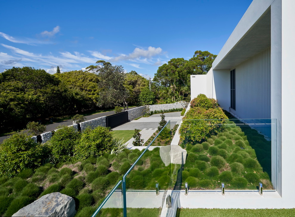 Immagine di un grande giardino xeriscape design esposto in pieno sole sul tetto con pavimentazioni in pietra naturale