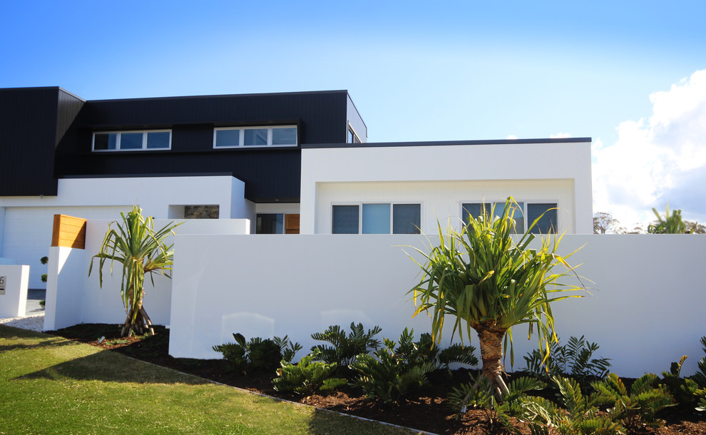 Immagine di un giardino minimalista esposto in pieno sole di medie dimensioni e davanti casa con un ingresso o sentiero